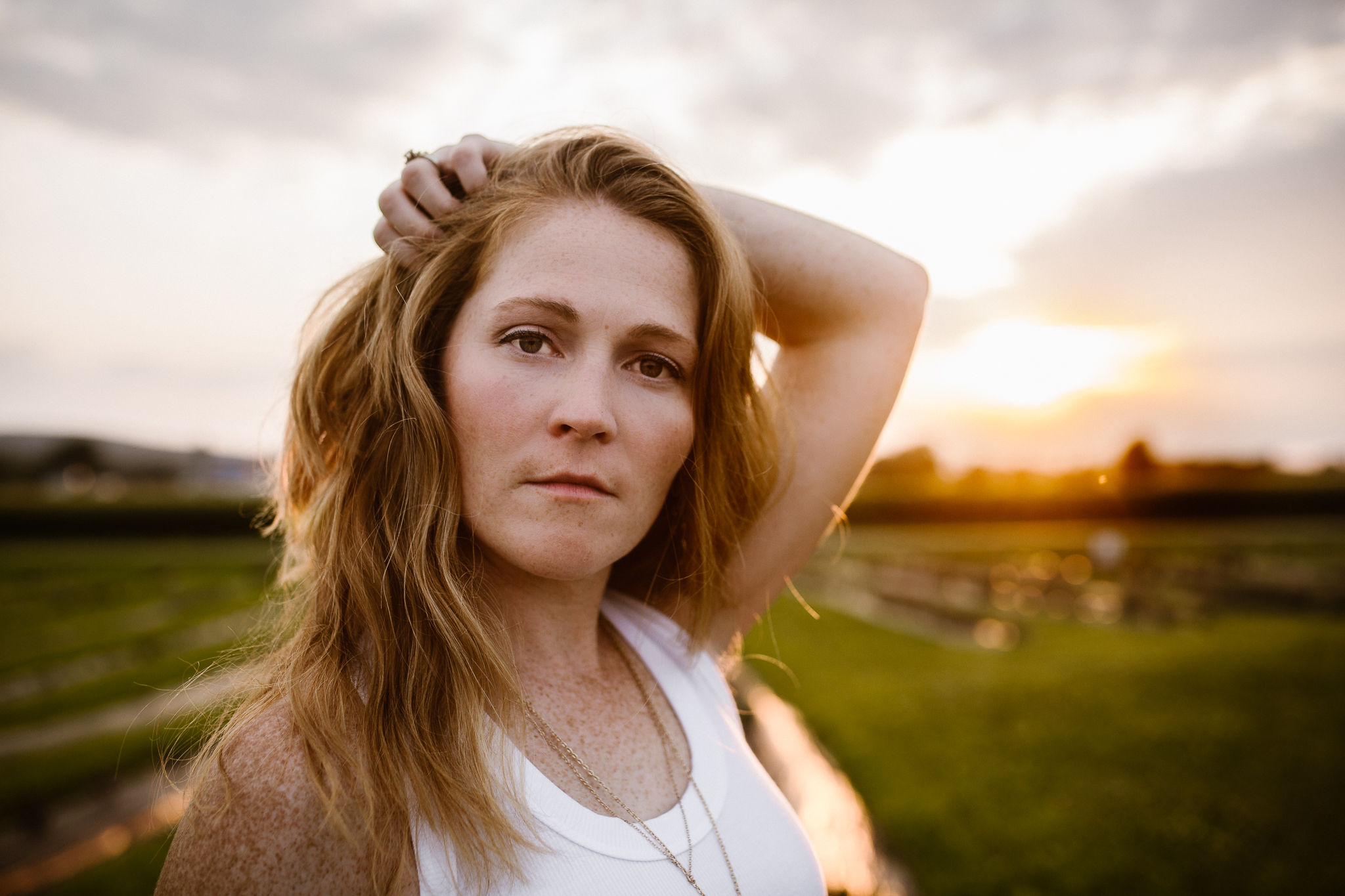 Female portaiture of a red head at sunset in a lavender field.